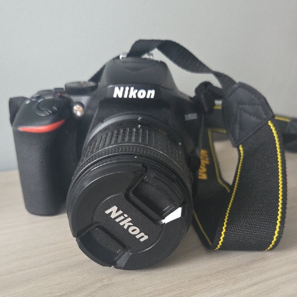 Nikon Black Camera D3500 with Zoom Lens and Black/Yellow Strap/ Charger Included